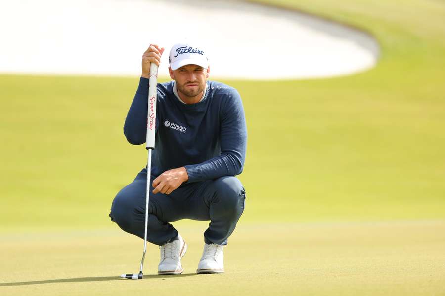 Wyndham Clark of the United States lines up a putt