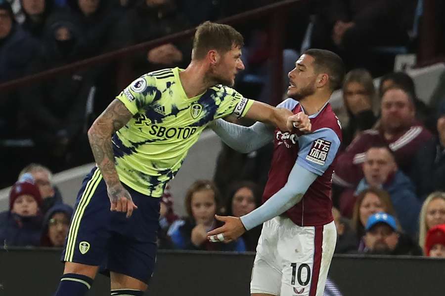 Scottish defender Liam Cooper clashes with Aston Villa's Argentinian midfielder Emiliano Buendia 