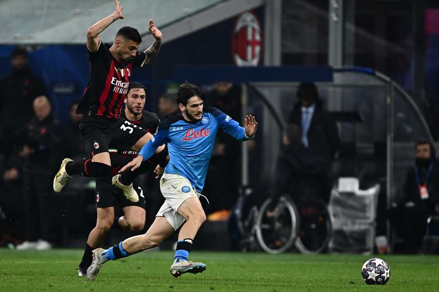 Napoli's Georgian forward Khvicha Kvaratskhelia challenges AC Milan's Bosnian midfielder Rade Krunic