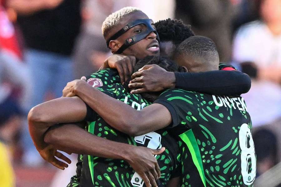 Nigeria players celebrate with Osimhen after his opening goal