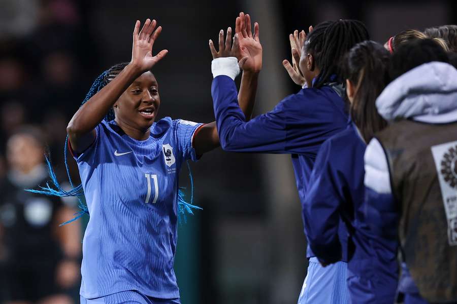 France's forward #11 Kadidiatou Diani celebrates scoring her team's first goal