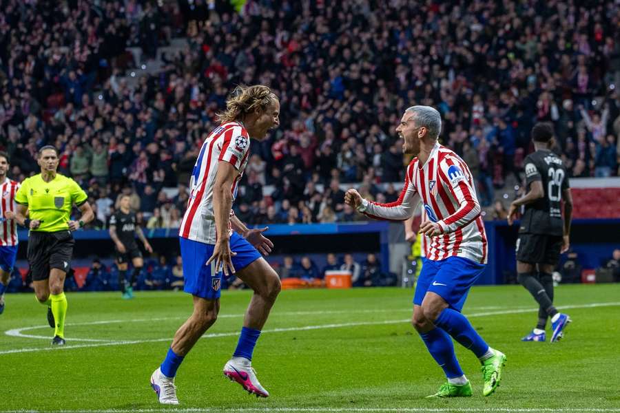 Atletico Madrid's Antoine Griezmann and Marcos Llorente celebrate a goal against Tottenham