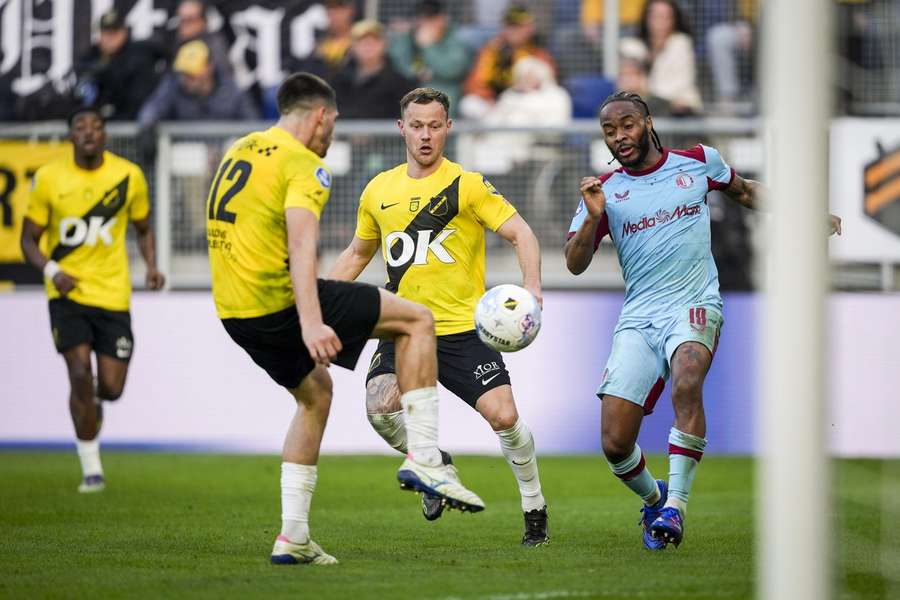 Feyenoord's Raheem Sterling (R) battles with NAC Breda's Leo Greiml and Boyd Lucassen Feyenoord's Raheem Sterling (R) battles with NAC Breda's Leo Greiml and Boyd Lucassen