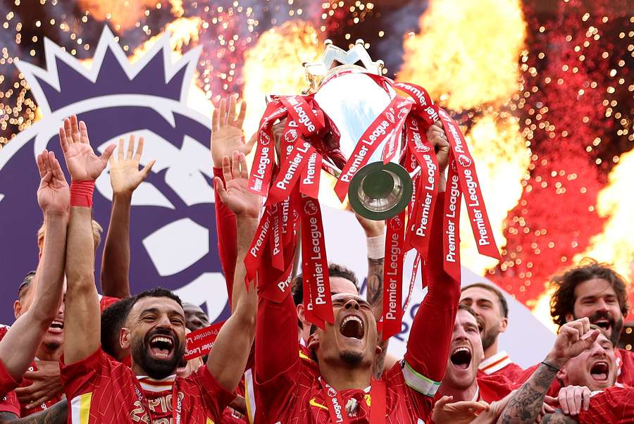 Liverpool celebrate as Virgil van Dijk lifts the Premier League trophy