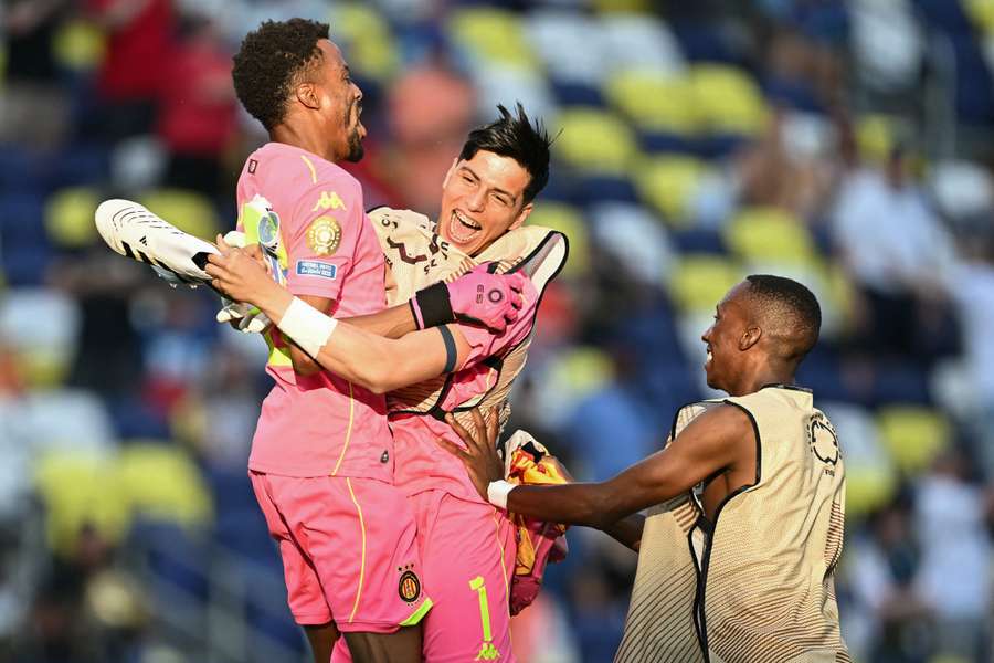 Esperance goalkeeper Ben Said (left) celebrates with goalkeeper teammate Amenallah Memmiche  (middle) after defeating Los Angeles FC