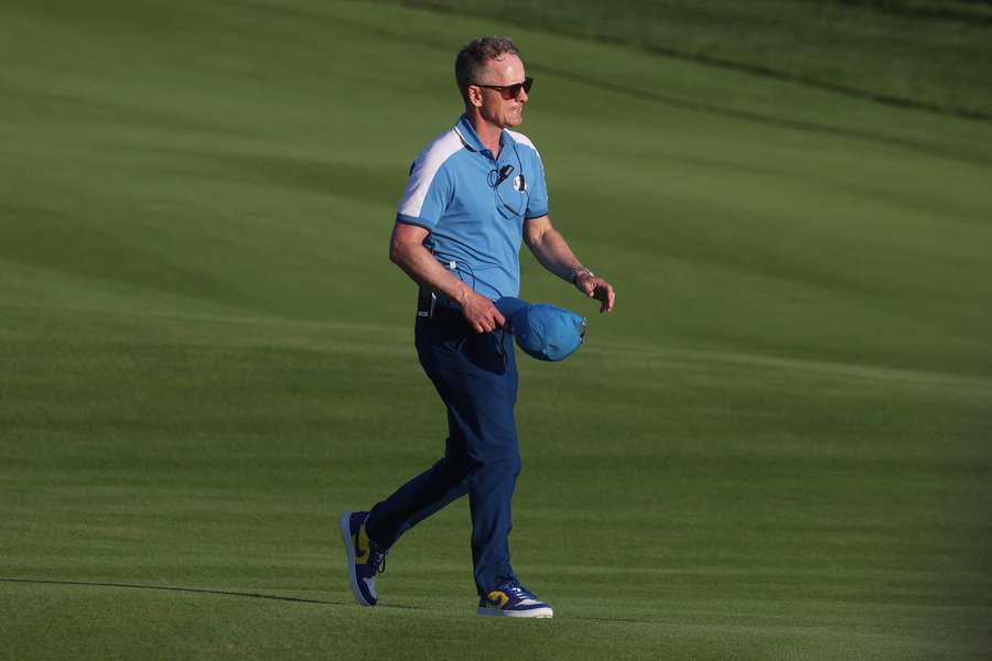 Luke Donald walks down the course on day one at the Ryder Cup