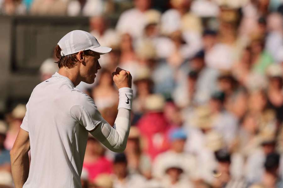 Jannik Sinner celebrates winning a point against Carlos Alcaraz