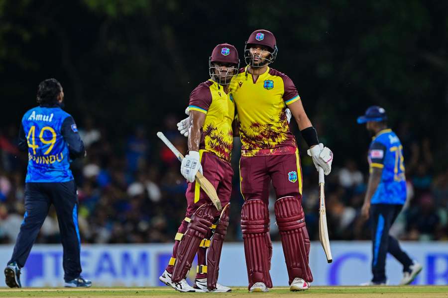 West Indies' Evin Lewis (right) celebrates with Brandon King after scoring a half-century