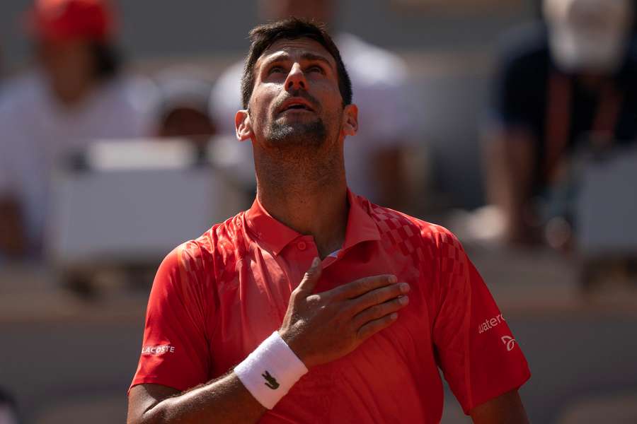 Novak Djokovic looks skywards after beating American Aleksander Kovacevic