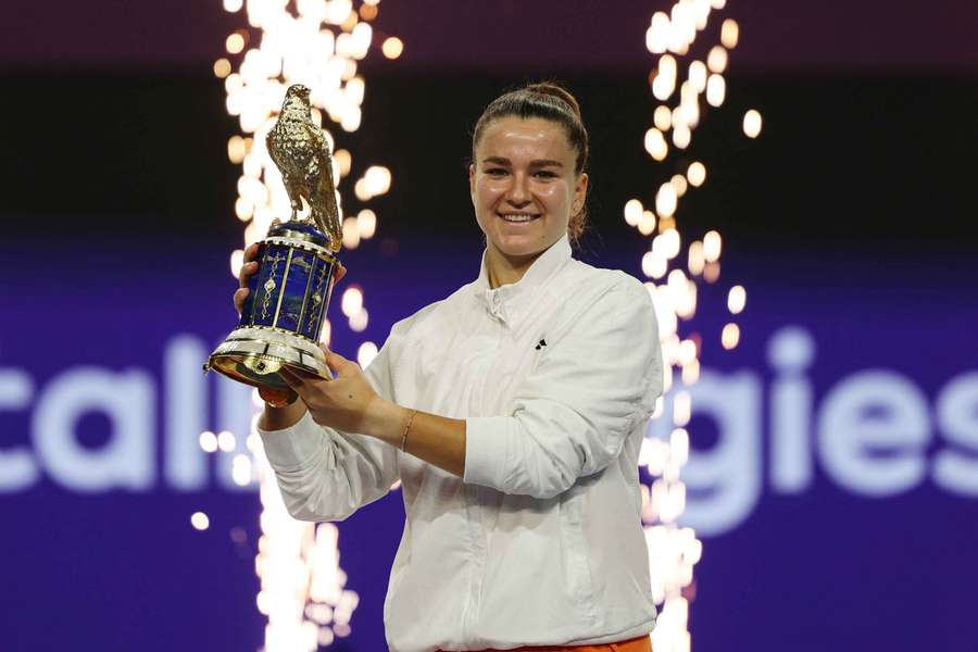 Karolina Muchova poses with the trophy as she celebrates after winning the final against Victoria Mboko Karolina Muchova poses with the trophy as she celebrates after winning the final against Victoria Mboko