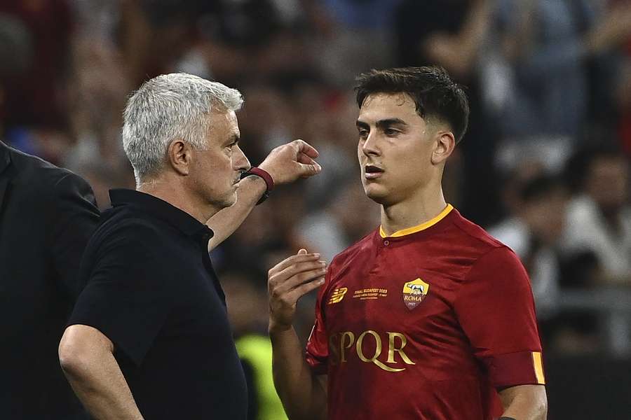 Jose Mourinho and Paulo Dybala in discussion during the 2023 Europa League final