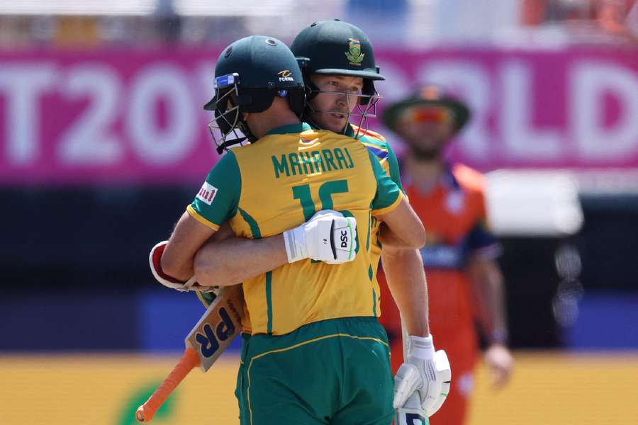 South Africa's David Miller and Keshav Maharaj celebrate after the match