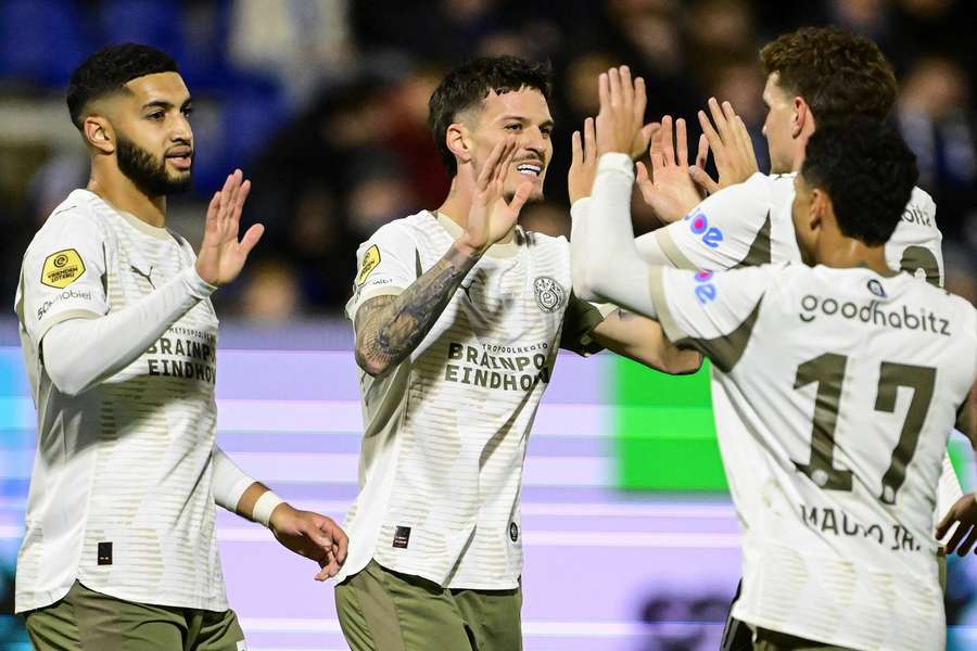 Dennis Man (centre) celebrates scoring the 2-0 with his PSV teammates