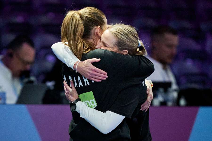 Head coach Helle Thomsen and assistant coach Bojana Popovic hug it out after Denmark's win against Romania