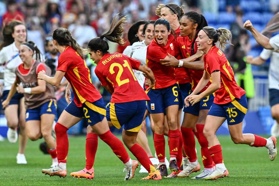 Spain's players celebrate their win on penalties