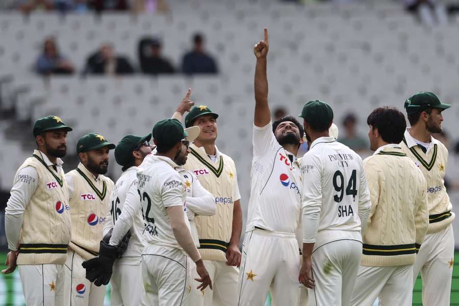 Pakistan's Aamer Jamal (C) celebrates after taking the wicket of Steve Smith