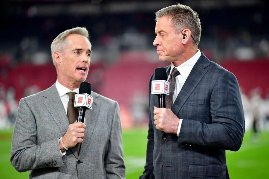 ESPN announcers Joe Buck (left) and Troy Aikman (right) talking ahead of the 2024 NFC Wild Card Game