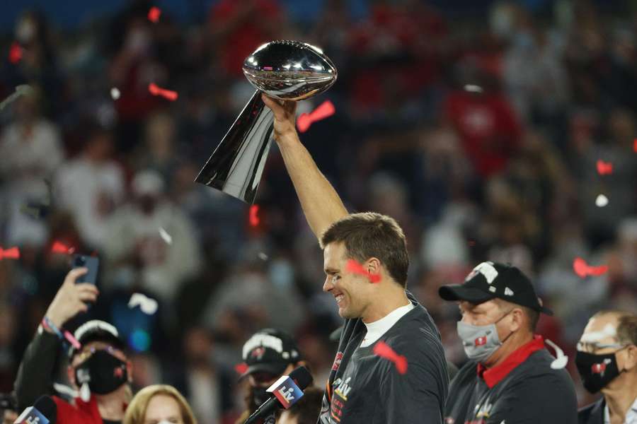 Tom Brady of the Tampa Bay Buccaneers celebrates with the Lombardi Trophy after defeating the Kansas City Chiefs in Super Bowl LV
