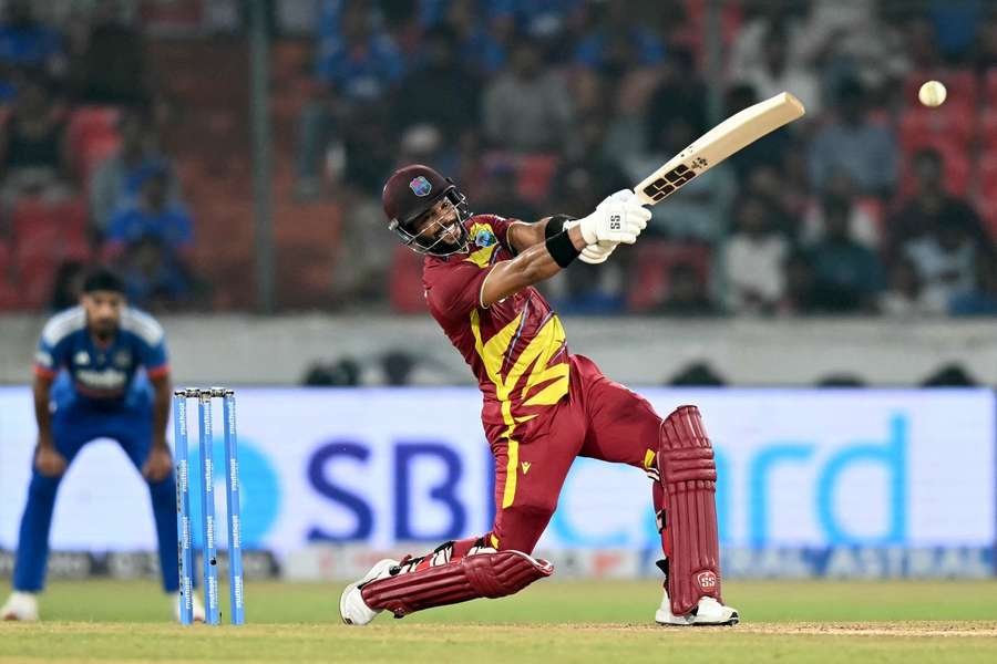 Shai Hope powers a ball to the boundary rope