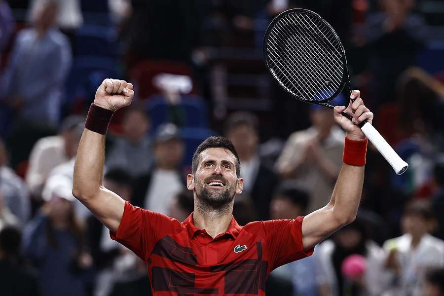 Novak Djokovic celebrates after winning his semi-final match against Taylor Fritzl