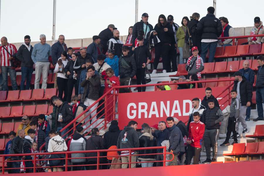 Supporters leave the stadium after the game is abandoned