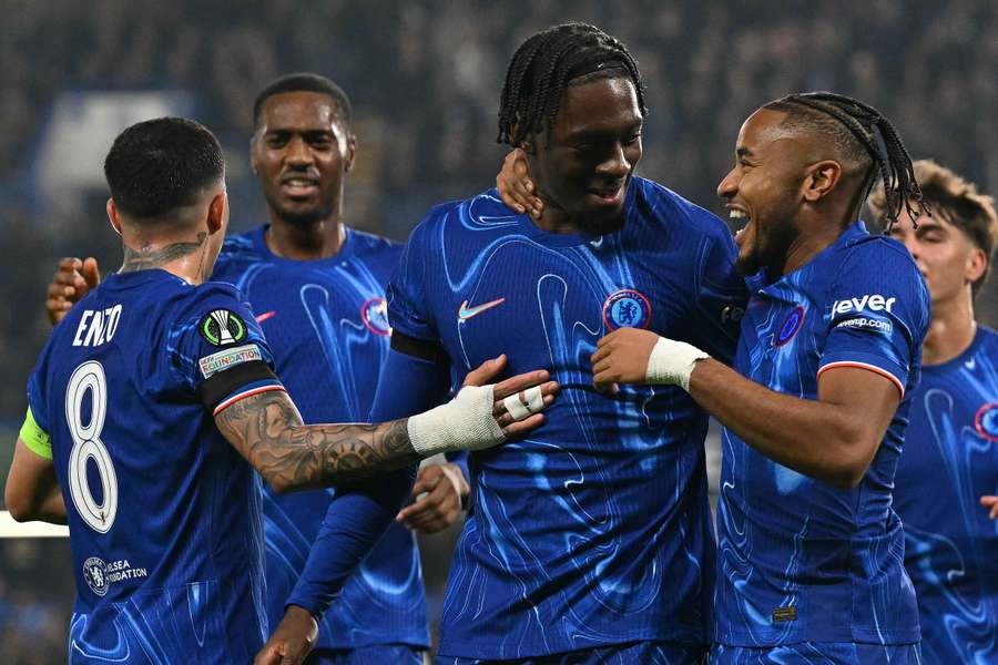 Chelsea's Axel Disasi (2R) celebrates with Christopher Nkunku