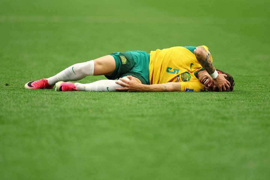 Australia's Jordan Bos reacts after getting injured at the World Cup