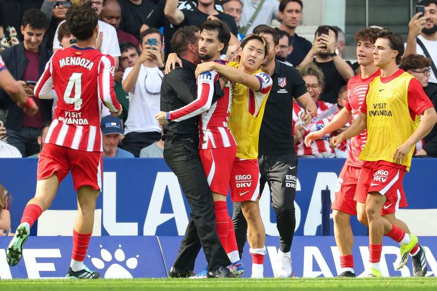 Baena celebrates his late winner with Simeone Baena celebrates his late winner with Simeone