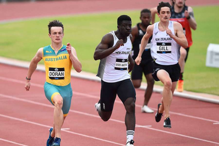 Jake Doran (left) competing in a sprint event in Townsville.