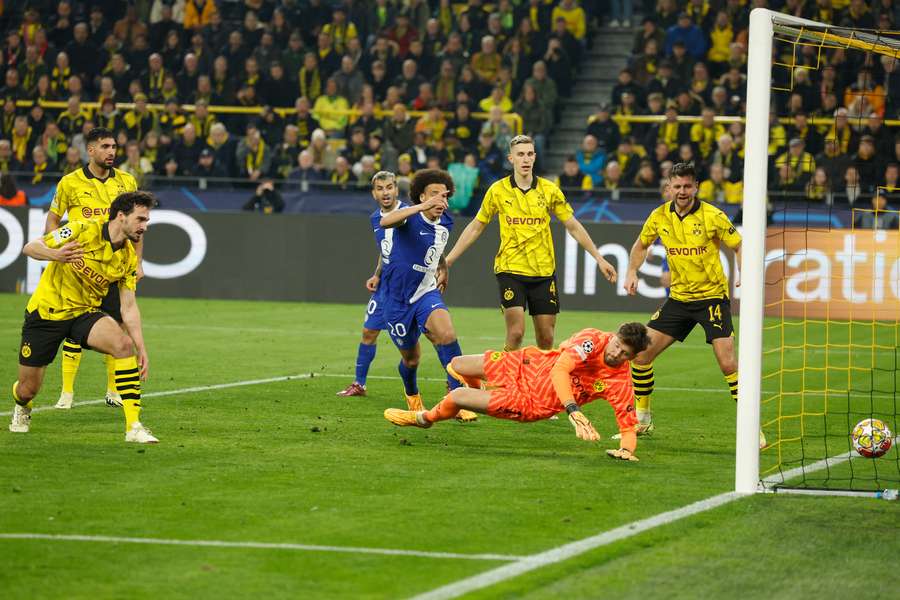 Dortmund's German defender #15 Mats Hummels (L) scoreas an own goal