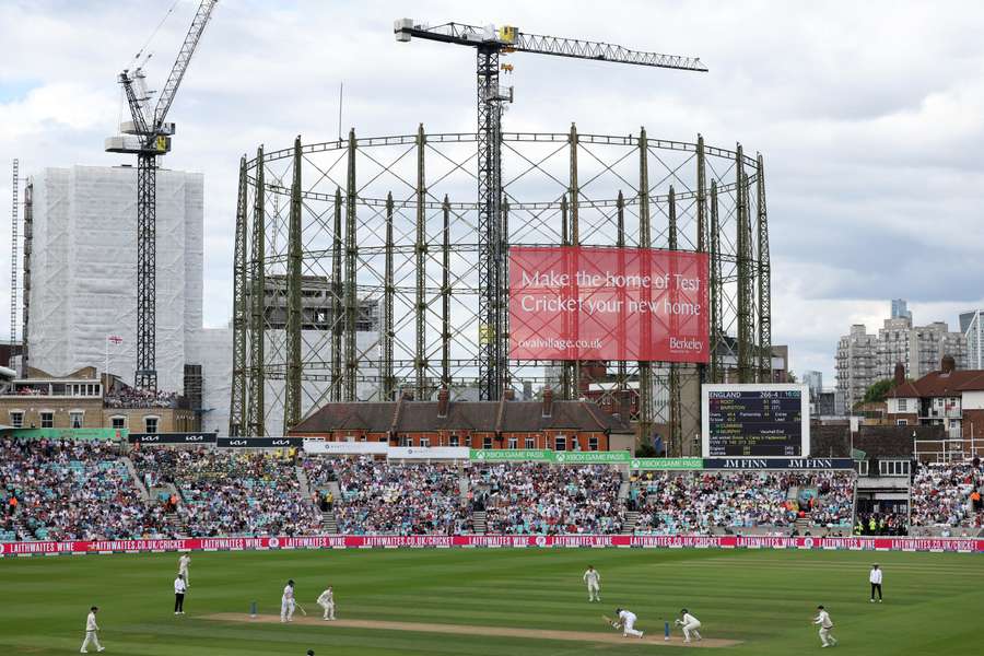 England's Joe Root plays a shot off the bowling of Australia's Todd Murphy in front of the famous gas holders