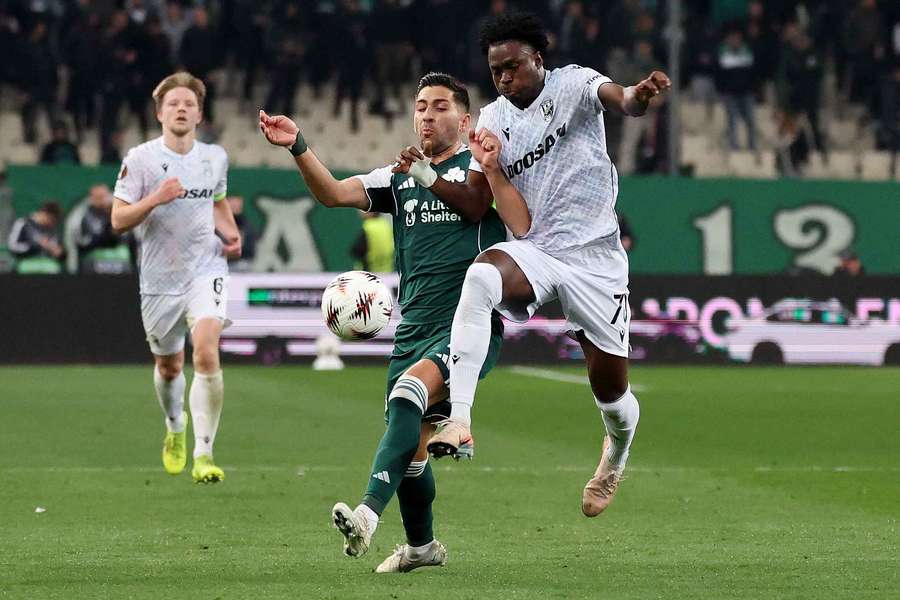 Panathinaikos' Anastasios Bakasetas in action with Viktoria Plzen's Salim Lawal