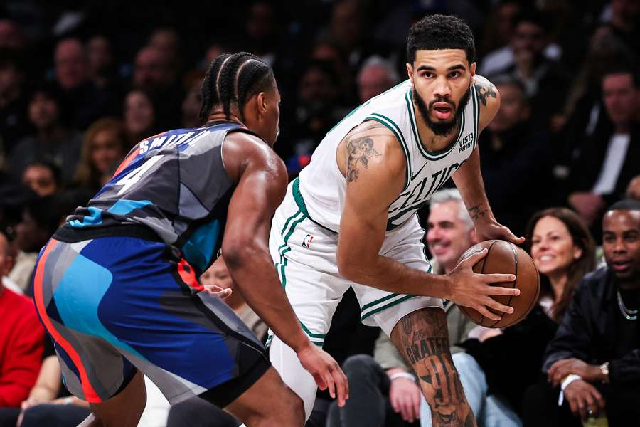Boston's Jayson Tatum scored 32 points and grabbed 11 rebounds to lead the unbeaten Celtics to a 124-114 NBA victory at Brooklyn