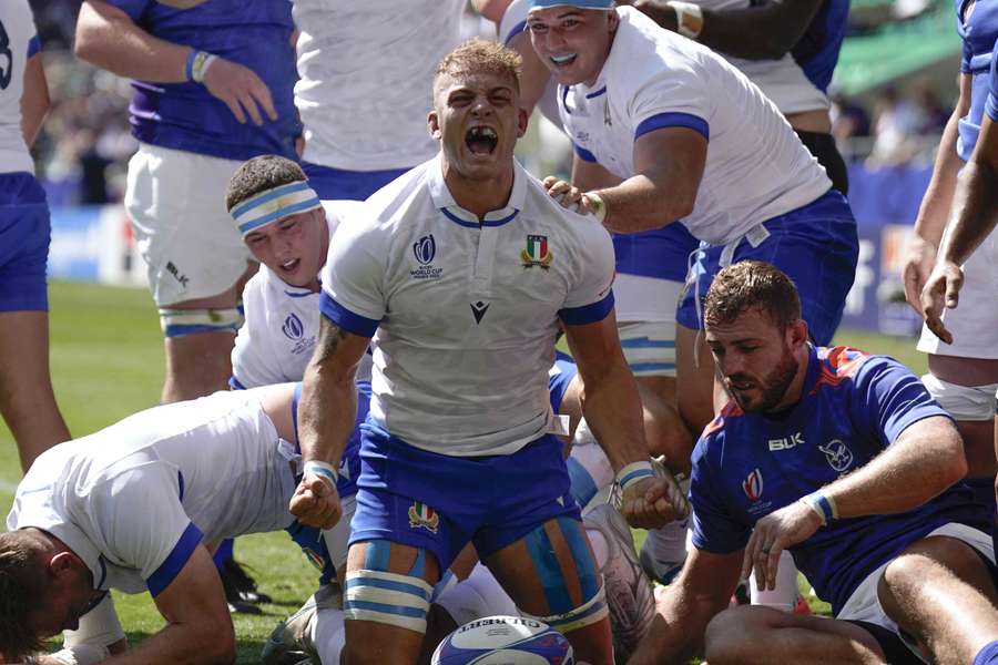 Italy's number eight Lorenzo Cannone celebrates scoring their first try against Namibia