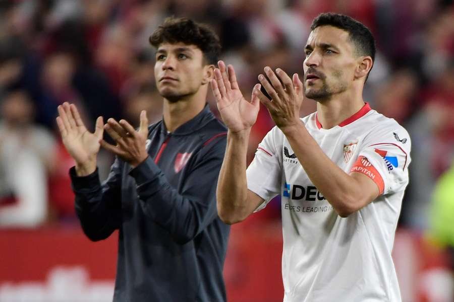 Sevilla defender Jesus Navas, right, applauds