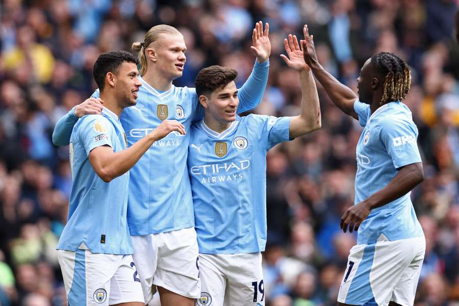 Manchester City players celebrating after goal