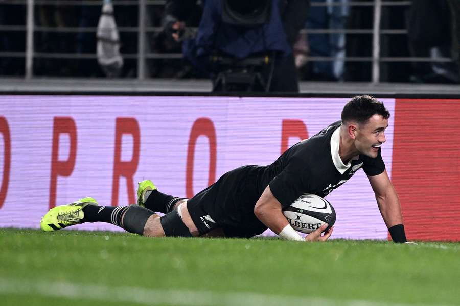 Will Jordan scores a try against France in July.