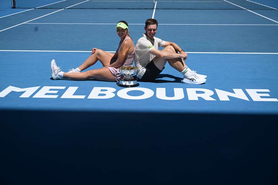 Olivia Gadecki and John Peers pose with the Australian Open mixed doubles trophy.