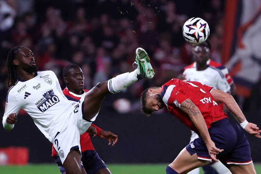 Brest's Bradley Locko battles with Lille's Olivier Giroud Brest's Bradley Locko battles with Lille's Olivier Giroud