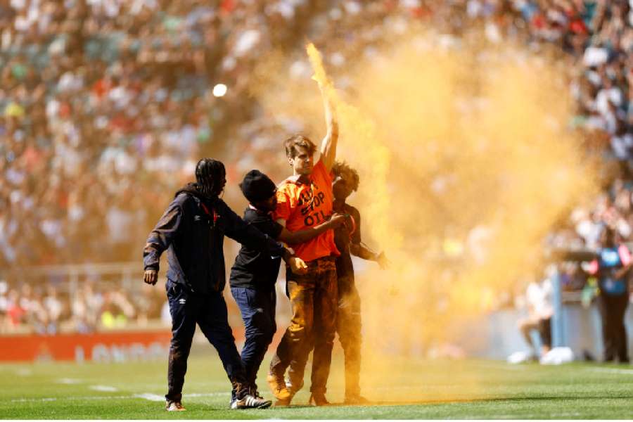 A Just Stop Oil protester on the pitch