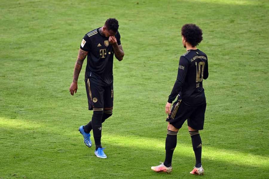 Jerome Boateng (left) walks off the pitch as he is substituted with Leroy Sane