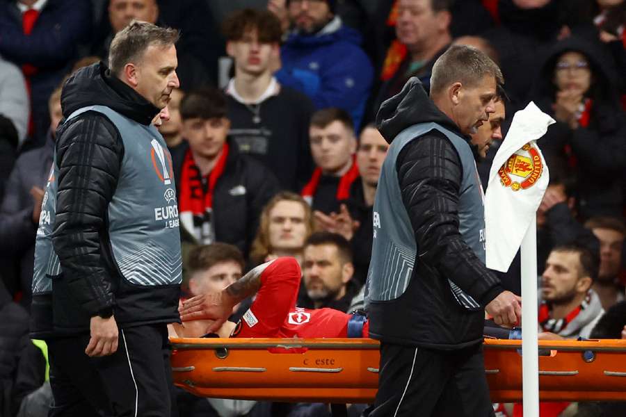 Martinez had to be stretchered off against Sevilla