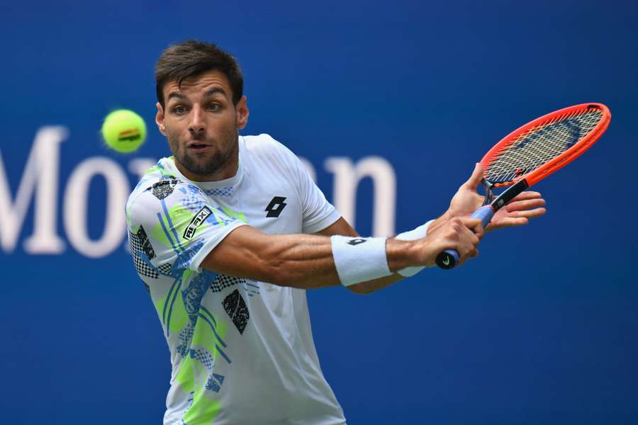 Bernabe Zapata Miralles hits a return to Novak Djokovic