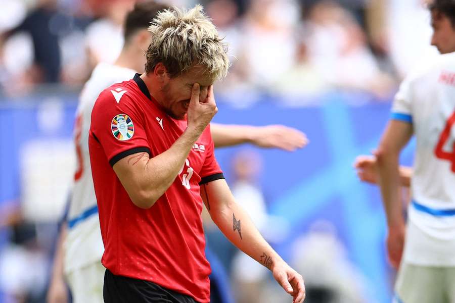 Georgia's Saba Lobzhanidze looks dejected after the match