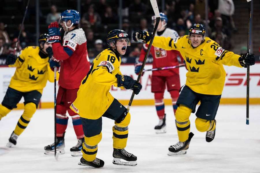 Sweden celebrate one of their goals in the final of the World Junior Championship