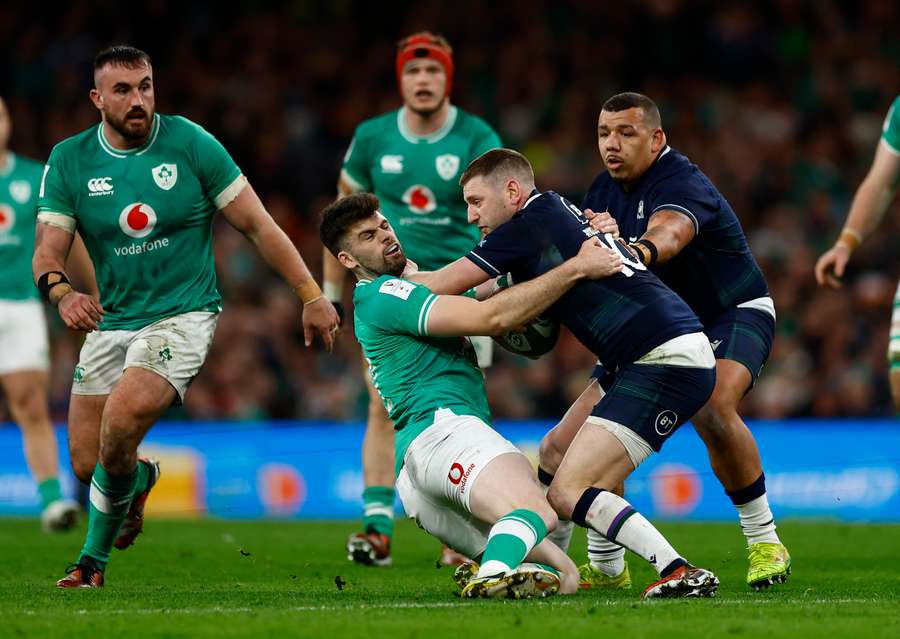 Scotland's Finn Russell in action with Ireland's Harry Byrne