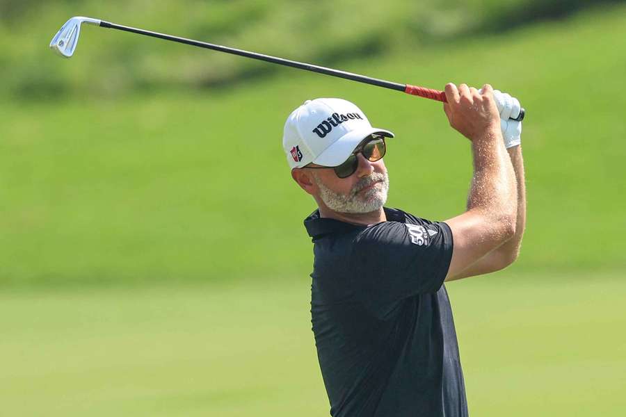 Paul Waring plays his second shot on the second hole during the third round of the Abu Dhabi Championship