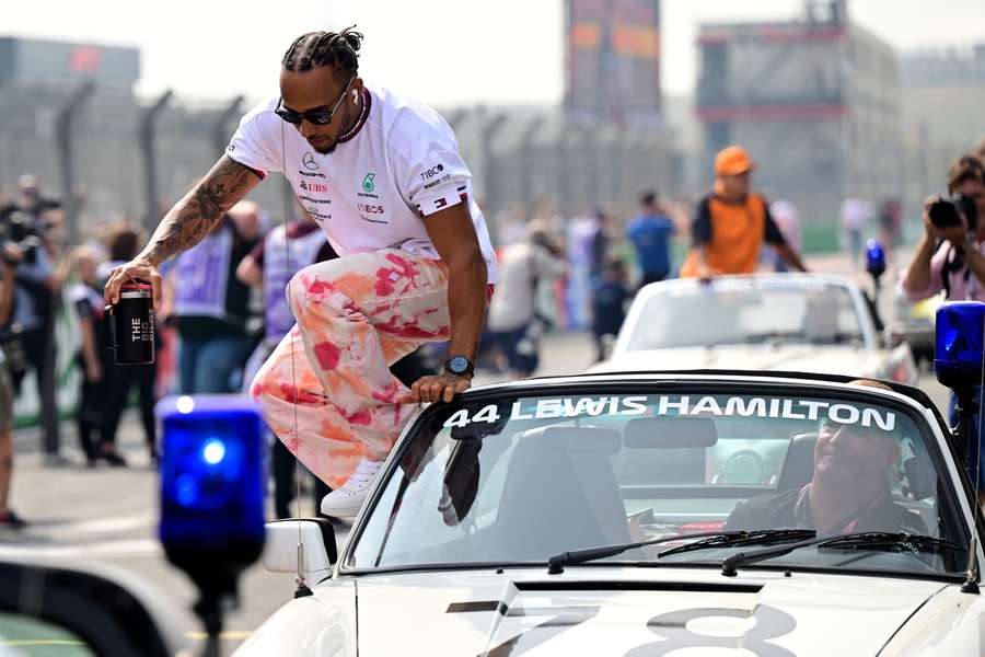 Lewis Hamilton exits his car ahead of Grand Prix