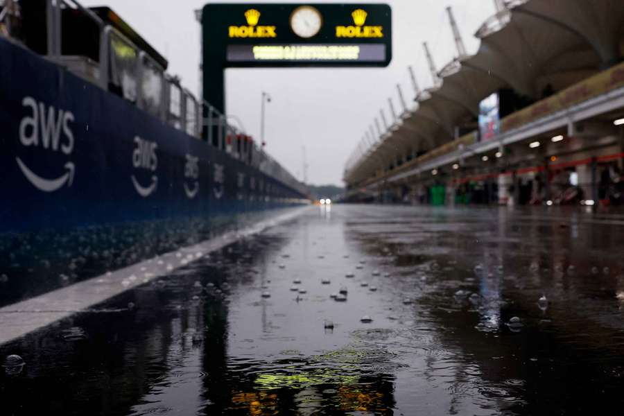 General view of rain in the pitlane after qualifying is postponed due to bad weather