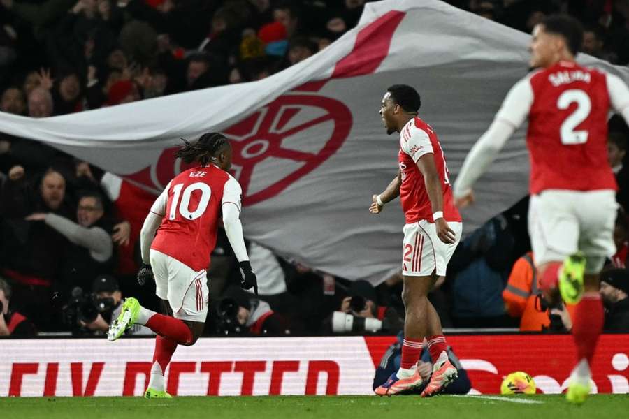Arsenal players celebrate during the north London derby